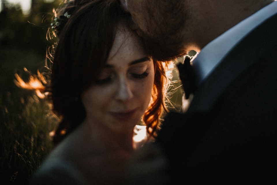 red haired bride and husband during golden hour light , kent wedding photography