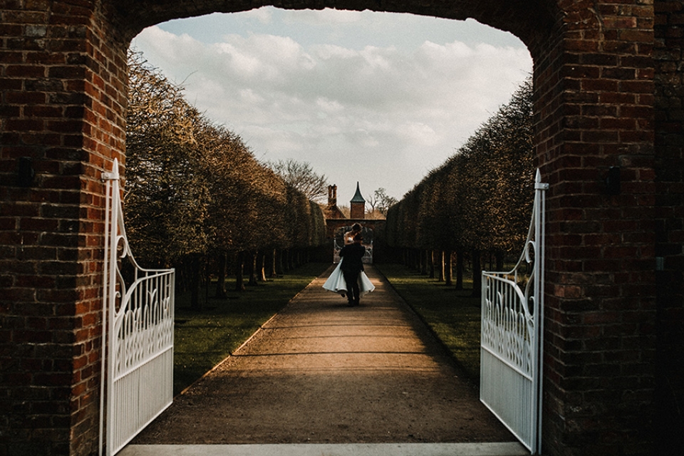 bride and groom having a playful dance in combermere gardens