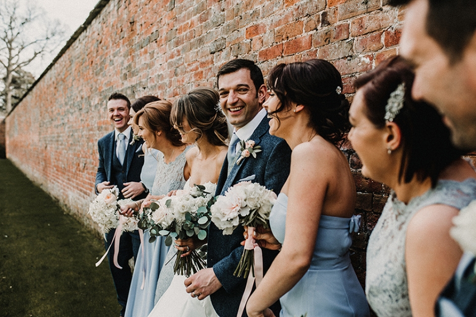 brides and ushers having a giggle at walled gardens in combermere