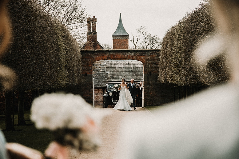 bride walking the gardens to her future , combermere gardens to the glass house