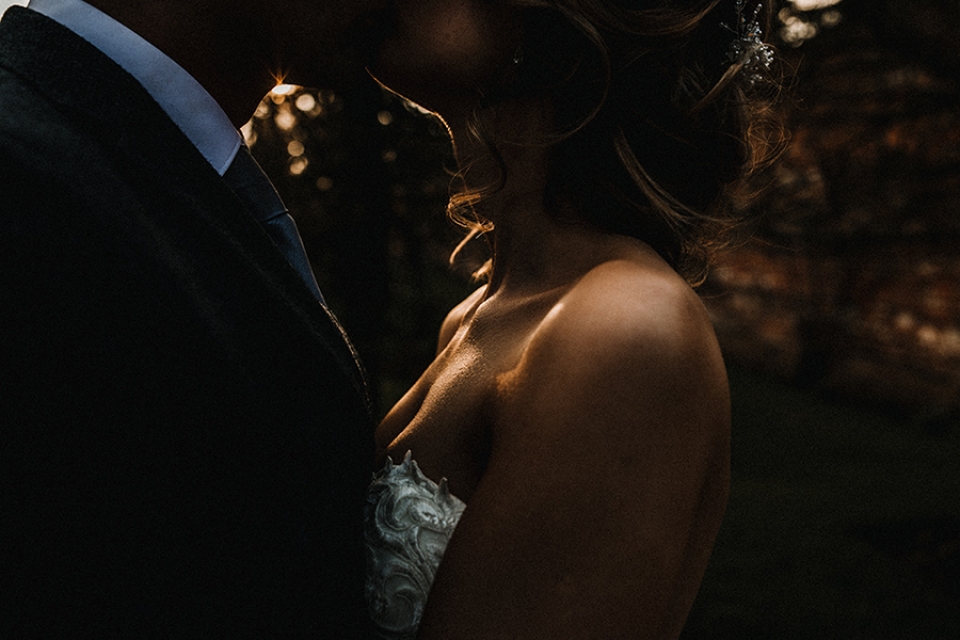 intimate couple shot in the golden light and dappled sun through trees