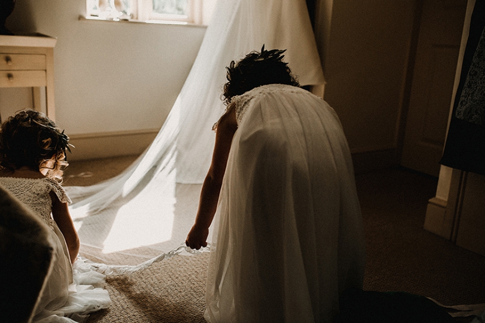 flower girls putting out veil