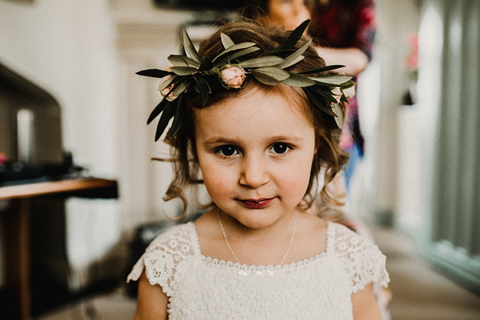 flower girl showing off her flower crown