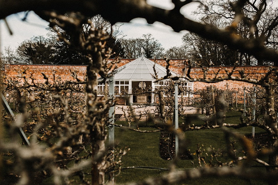 the glass house at combermere abbey , through the maze