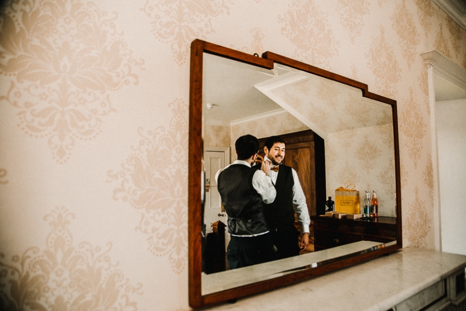 groom getting ready before the church