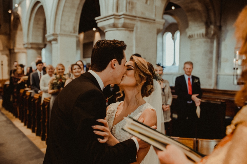 first kiss at industrial northbrook park wedding ceremony