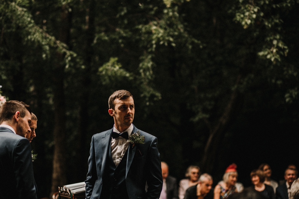 groom with ushers awaiting bride 