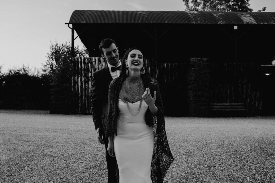 bride and groom laughing - crips barn