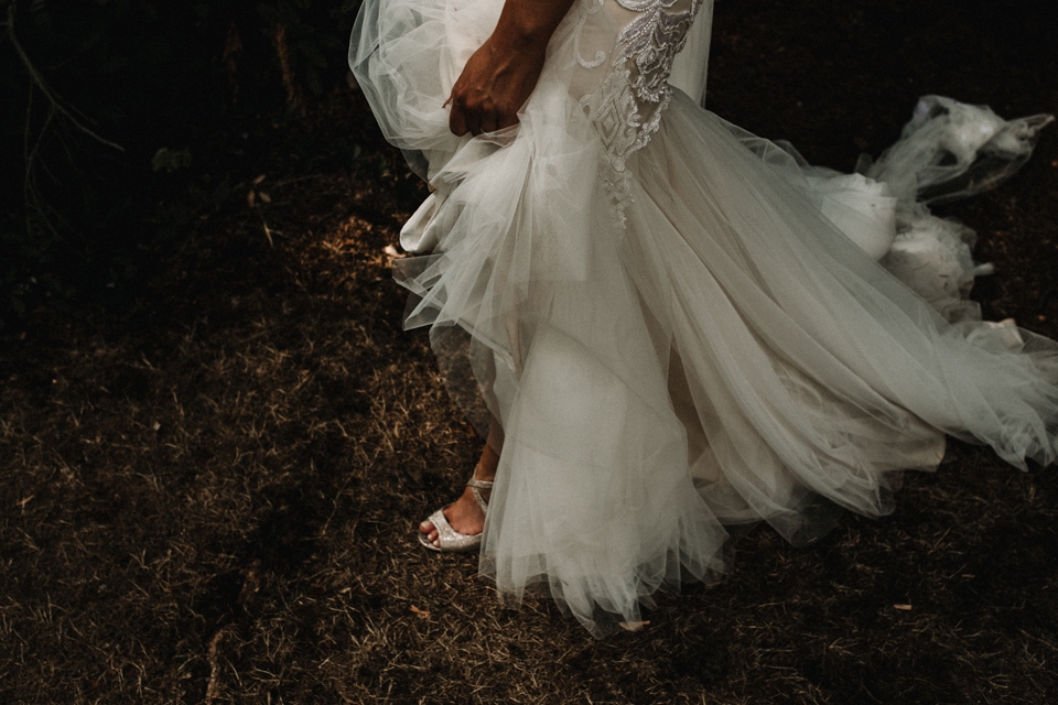 bride walking trough the gardens at Isycoed park