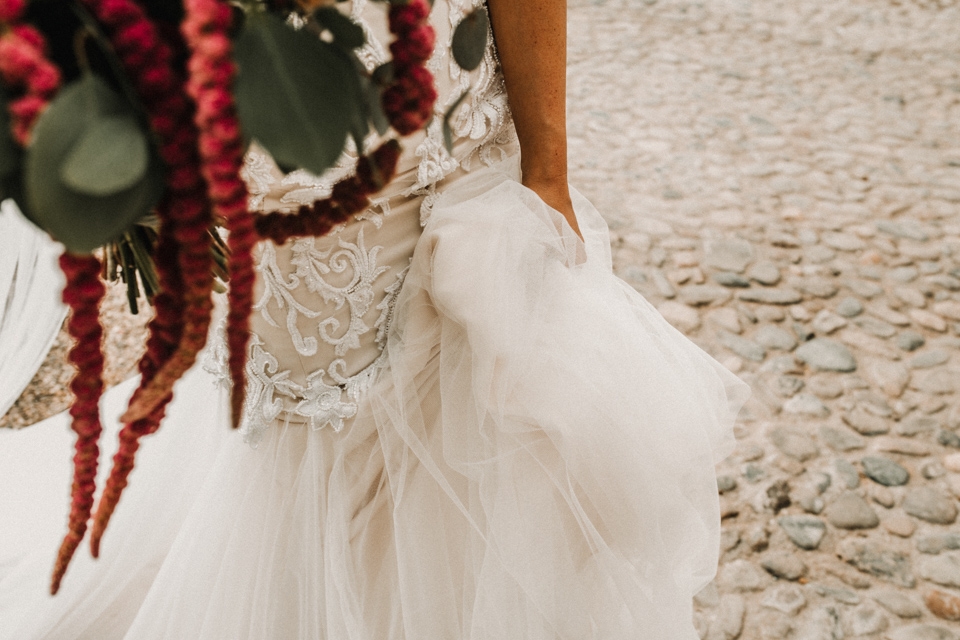 bride holding beautiful flowers by Vivid floral design