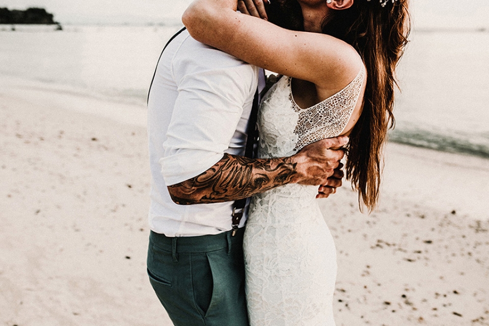 Bride wears grace loves lace and groom holds her was it exposing his tattooed arms