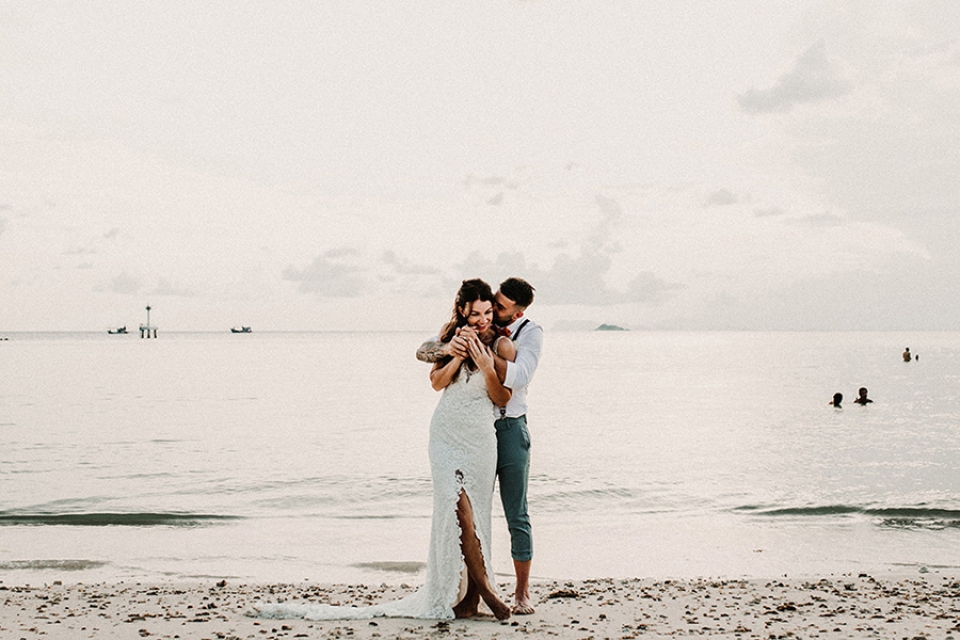 beautiful fashion image of bride and groom - bride wearing a grace loves lace boho dress