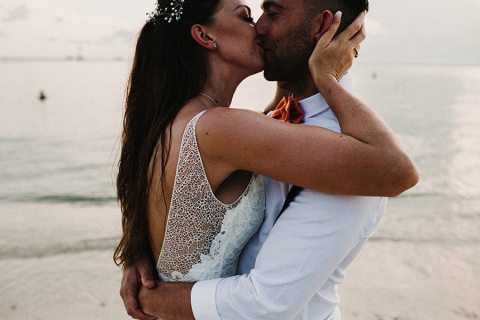 couples first kiss in private on the beach in thailand