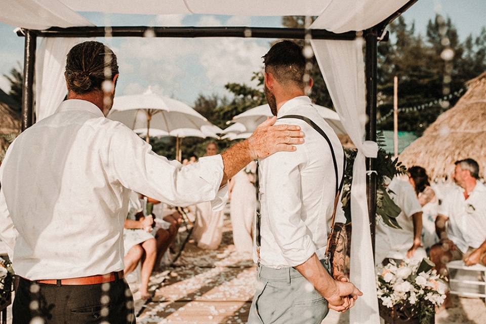 the ceremony starts groom watches bridesmaids walk down the aisle