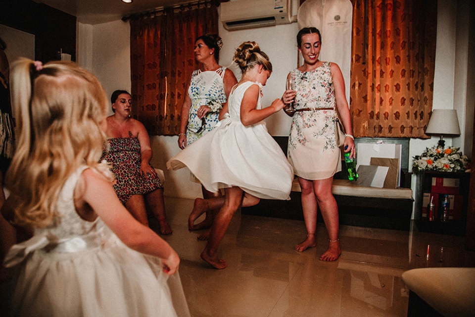 brides daughter spinning in bridal prep room.