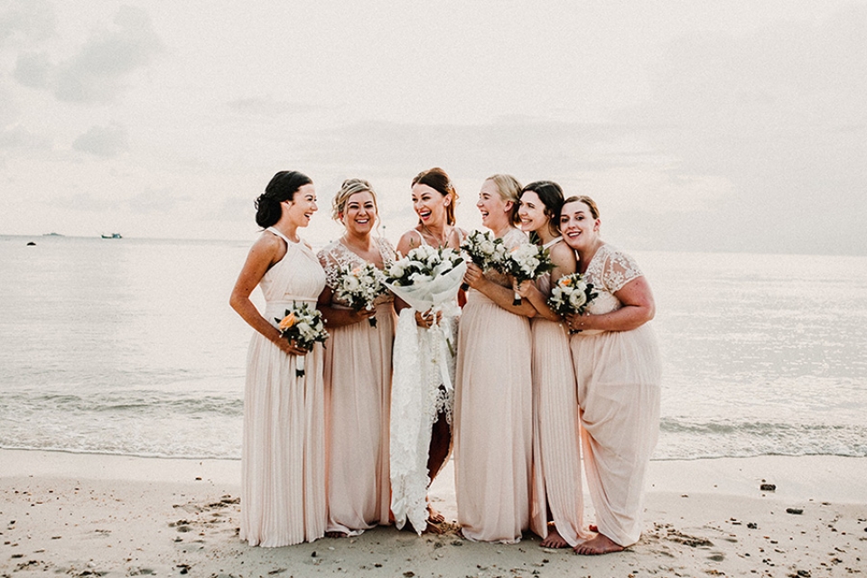 beautiful bridesmaids on nice sear resort beach