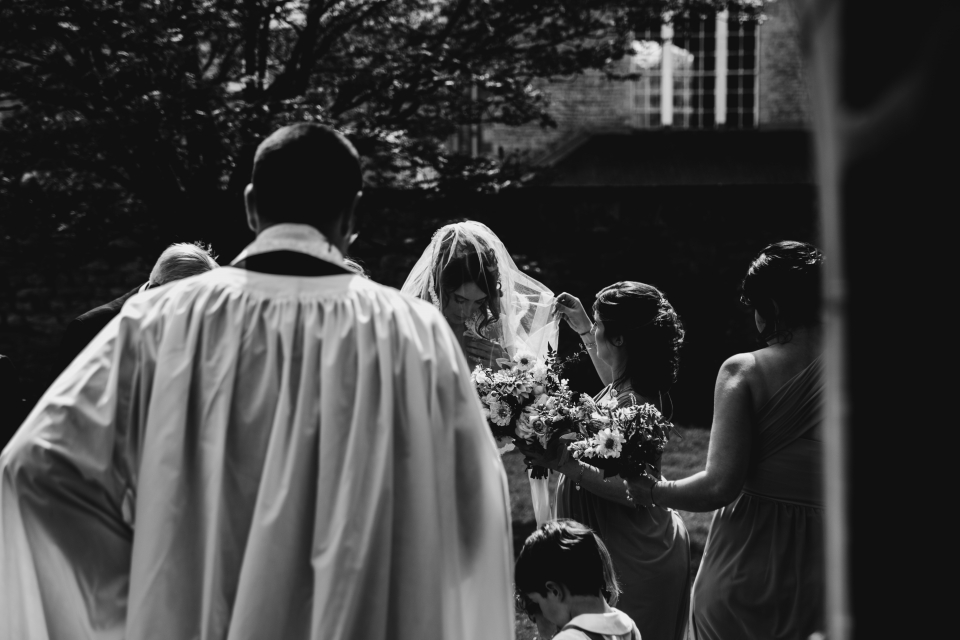 bride getting ready to m get her husband down the wedding aisle