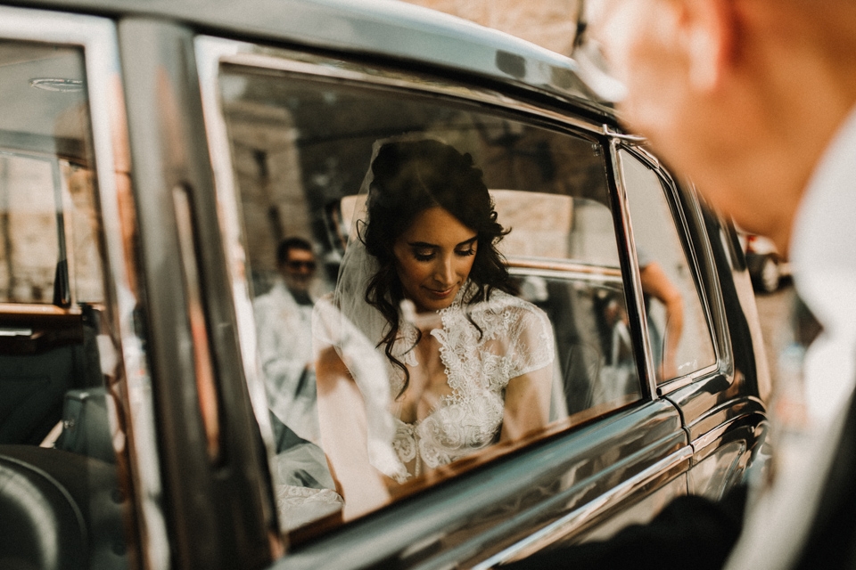 bride arriving in her vintage bentley at york wedding