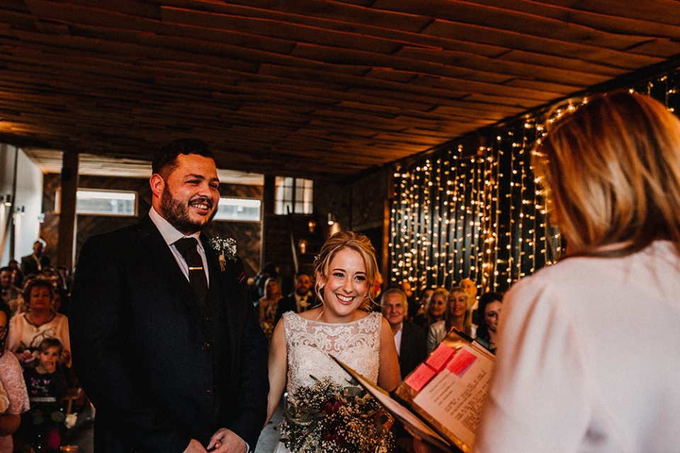 bride and groom during ceremony at owen house barn