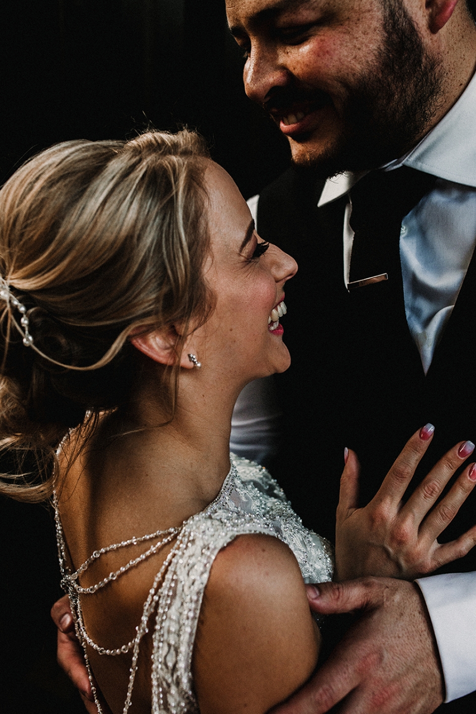 bride and groom kissing at Owen house barn 