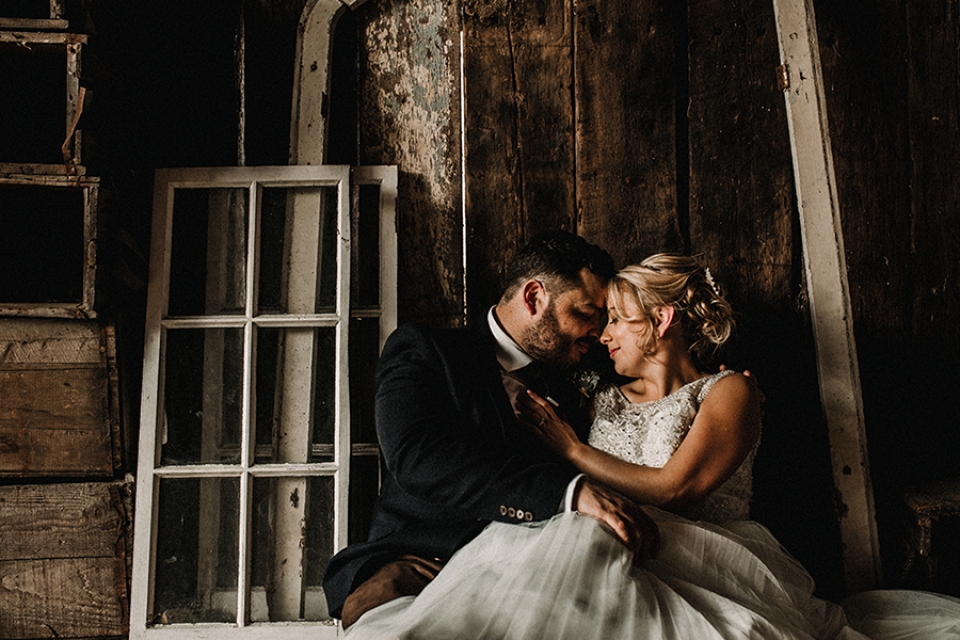 newly wed couple sitting on the floor enjoying a quiet moment together