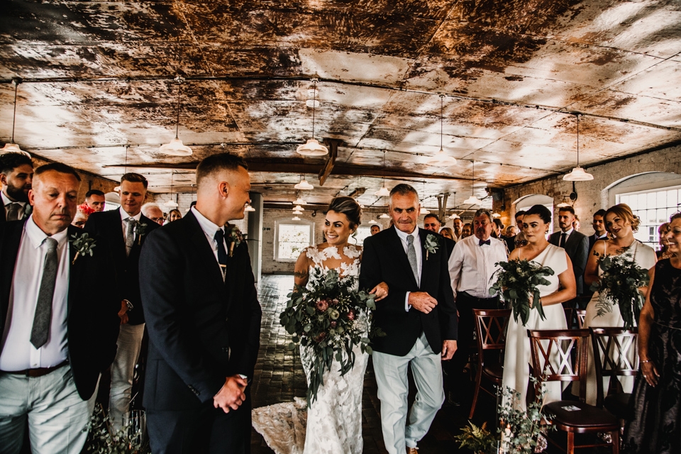 bride walking down the aisle to ceremony