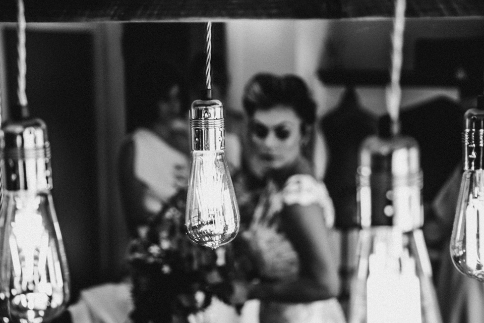 creative photograph of bride taking final glance in the mirror x