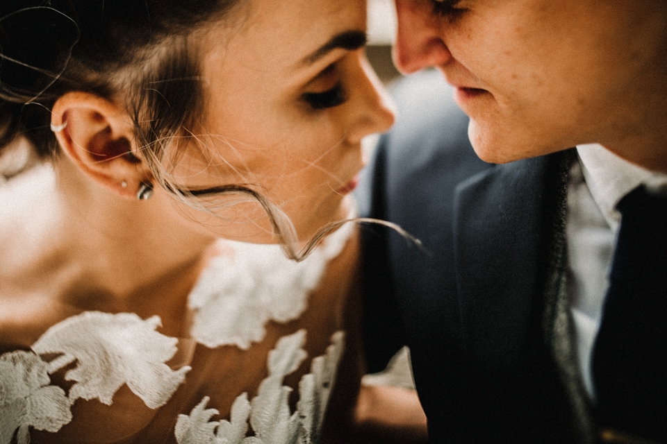 creative and intimate close up photograph of bride and groom in love